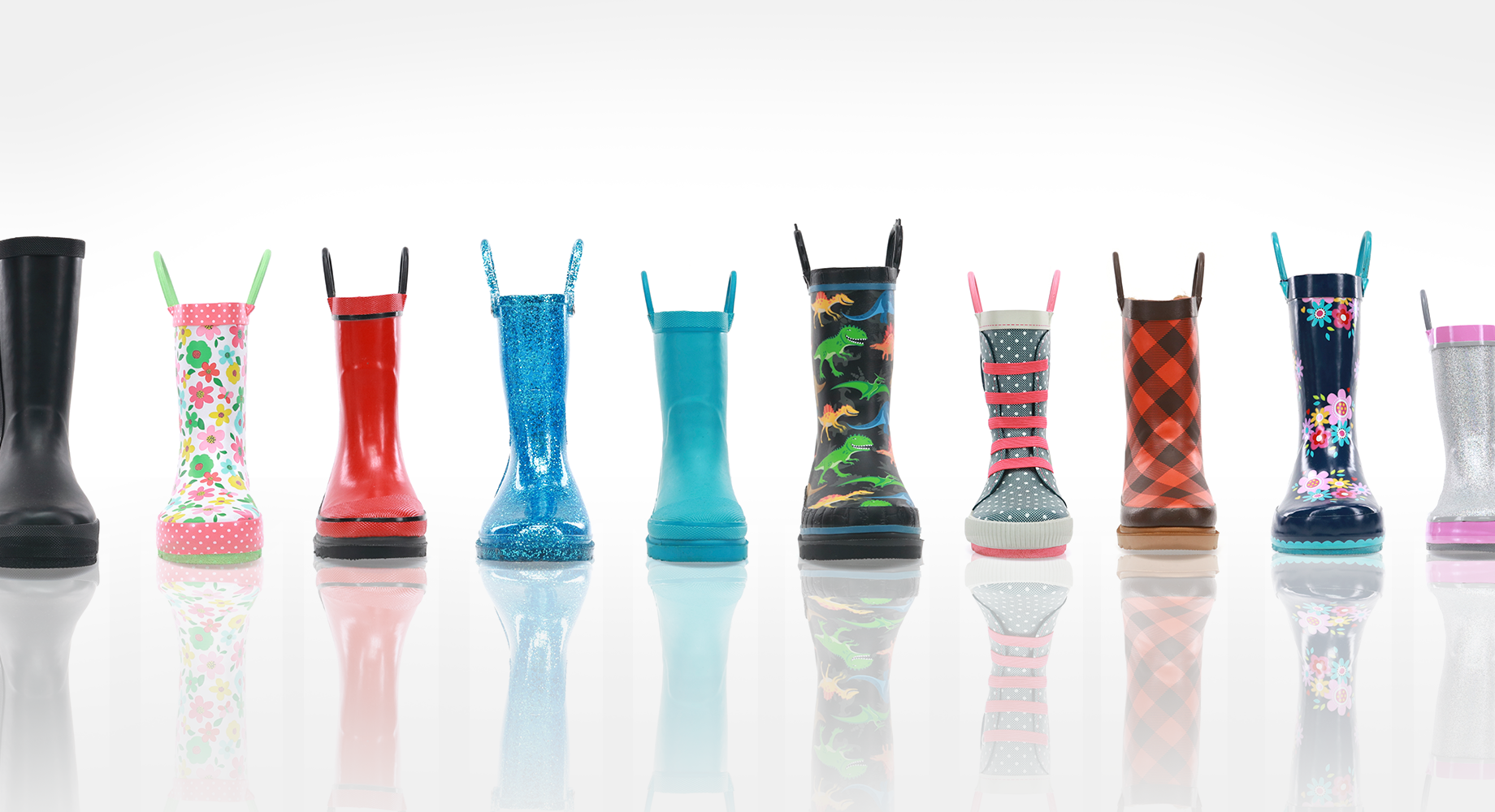 Line of kids rain boots on white background
